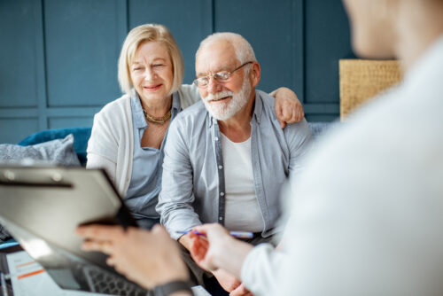 Do you need a lawyer for your estate plan? senior couple meeting with attorney to decide